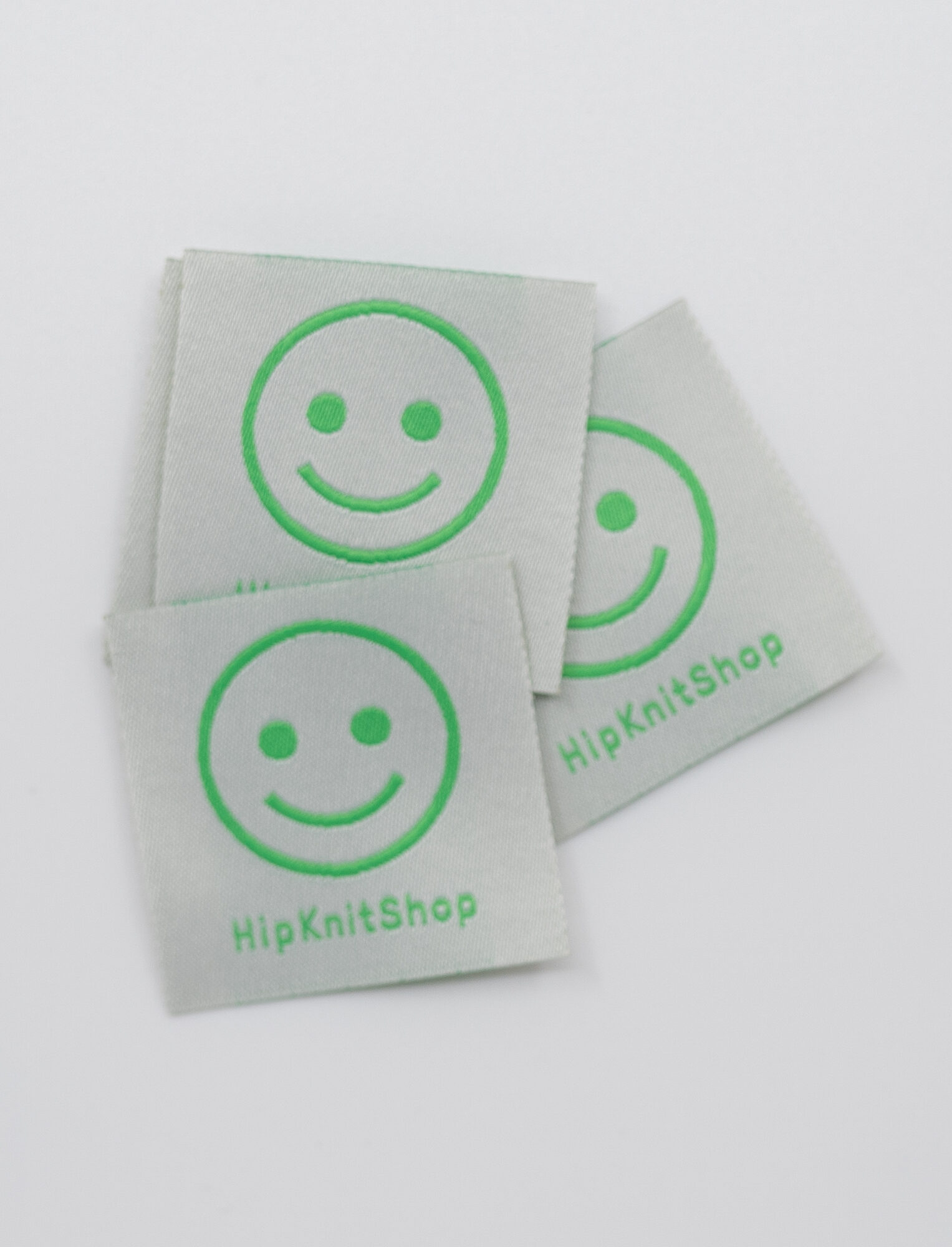 97243-Smiley-label-gronn-1 - HipKnitShop vevde merkelapper strikk