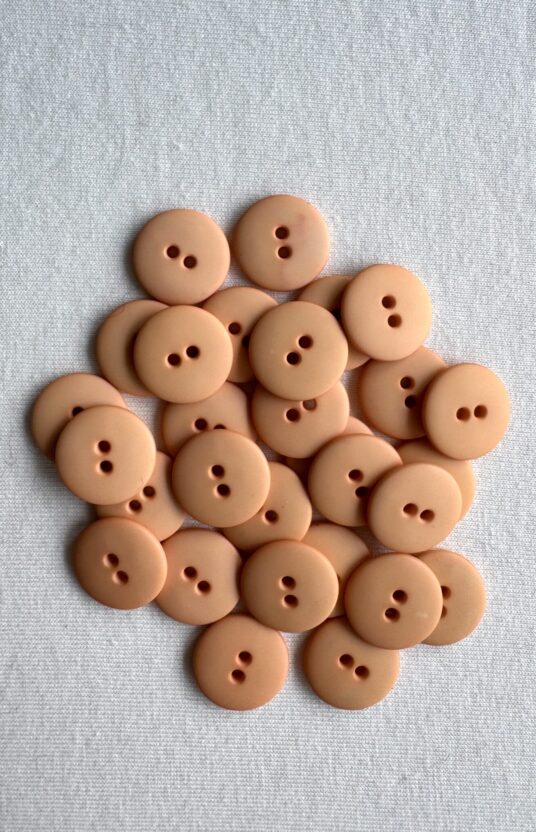 Peach matt plastknapp