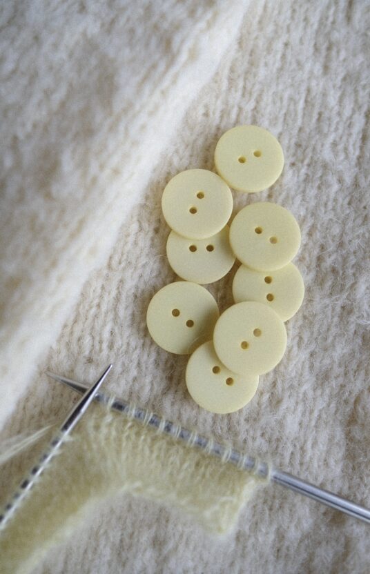 Light yellow buttons, pastel yellow buttons, yellow plastic buttons, buttons for knitted jacket, cardigan buttons, knitting buttons, two hole buttons, buttons for sweater, soft yellow buttons, cute knitwear buttons.