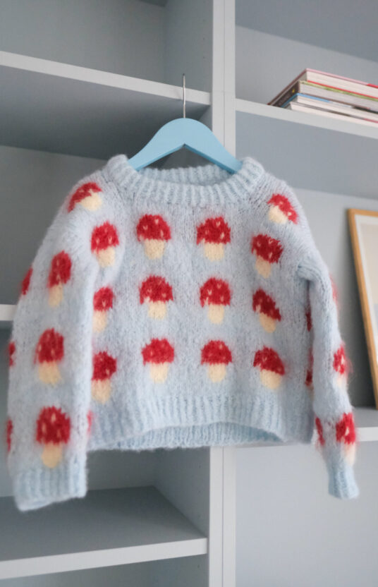 Mushroom Sweater Knitting Pattern - HipKnitShop Knitting pattern for a mushroom sweater. Sweater for girl and boy with mushrooms. Easy knitting pattern for children using brushed alpaca. Knitted sweater with mushroom pattern and yarn. Kids' mushroom sweater knitting pattern.